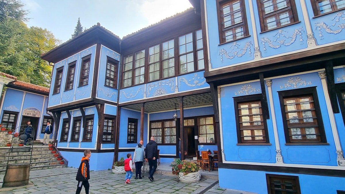 Sj and family standing in House-Museum Hindlian, Plovdivhouse, one of the things to do in Plovdiv.