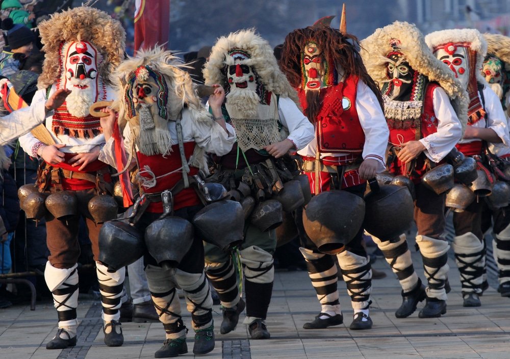 winter in Bulgaria - Kukeri, mummers perform rituals with costumes and big bells, intended to scare away evil spirits during the international festival of masquerade games Surva in Pernik, Bulgaria