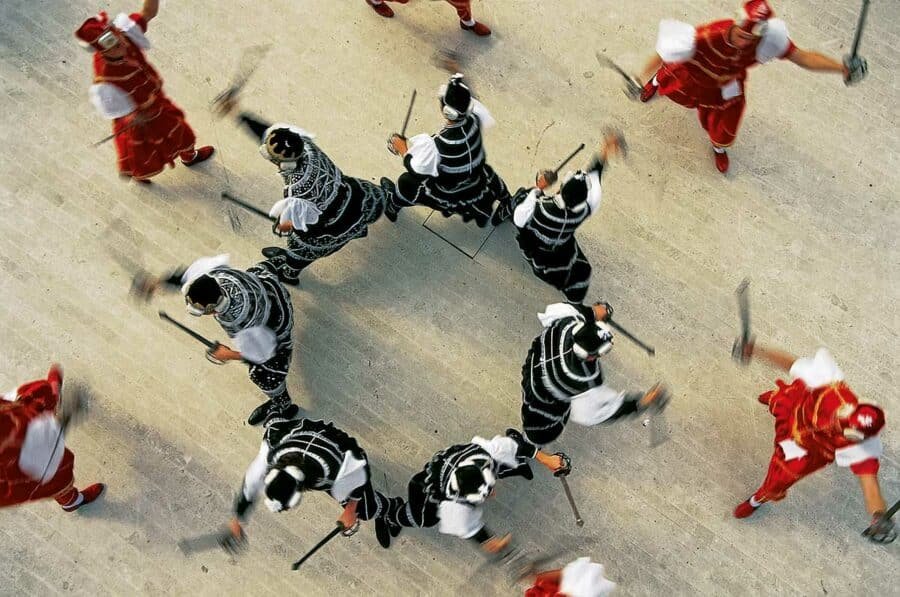 A group of people with swords at Korcula sword dance festival in Croatia.