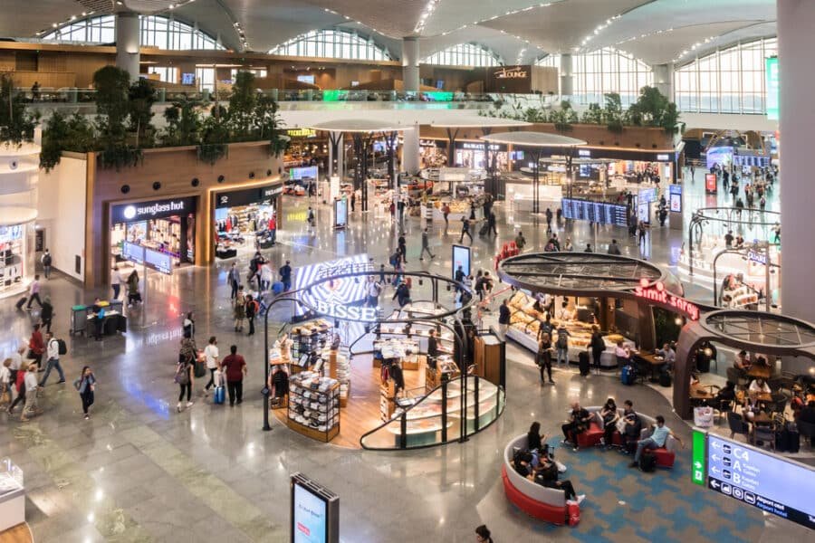 Shopping at Istanbul Airport - People in the departure hall of the airport