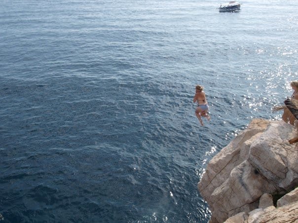 SJ jumping off Buza Bar cliff in Dubrovnik