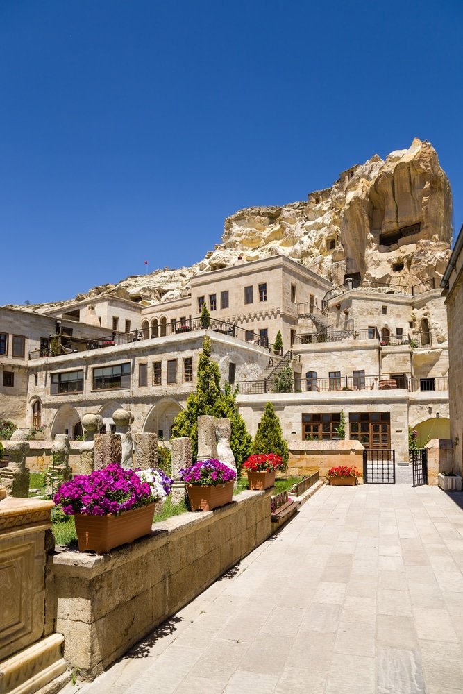 Historic stone buildings housing restaurants in Cappadocia Turkey. Urgup view of the city from the courtyard of the mosque